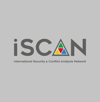 The iSCAN logo is composed of a text in a grey bald angual font. the A is used as a pictogram: it's a triangle divided in four smaller triangles (green on top, yellow on the bottom left, red at the center, and ligh blu on the bottom right). Below the main text, you can read the acronym Internationa Securrity and Conflict Analysis Network. The background is light grey.
